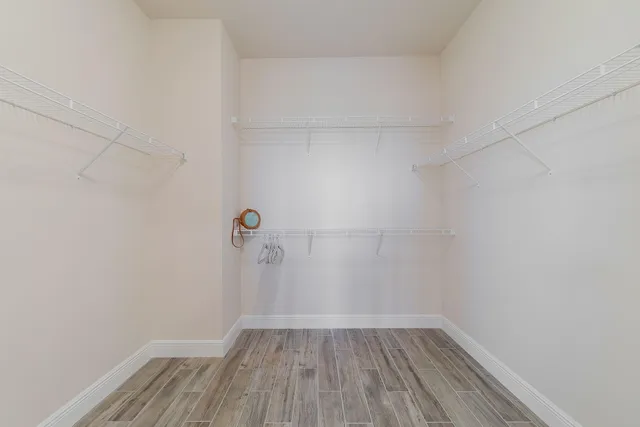 a bed room with a bed and a chandelier