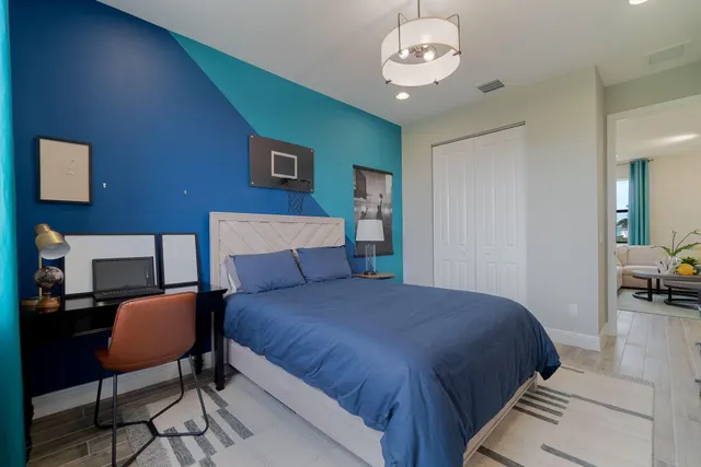 a view of a house with swimming pool and sitting area