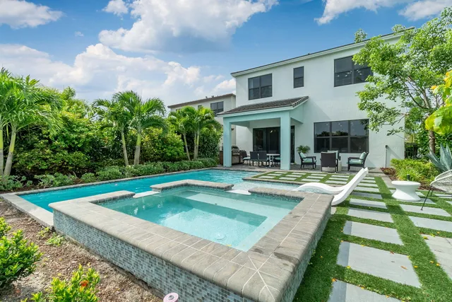 a view of a swimming pool with a patio