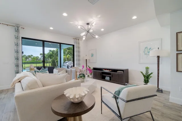 a kitchen with stainless steel appliances kitchen island granite countertop a sink and cabinets
