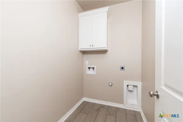 a view of a small space with wooden floor