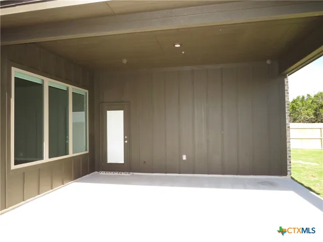 a view of entrance gate of a house
