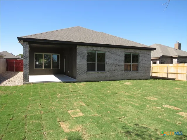a view of a house with a yard and garage