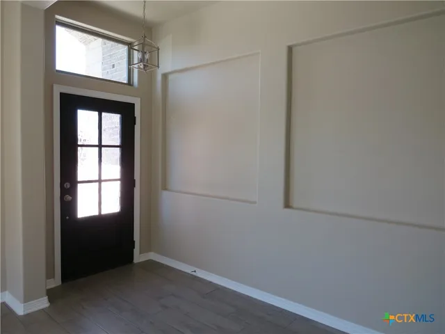 an empty room with windows
