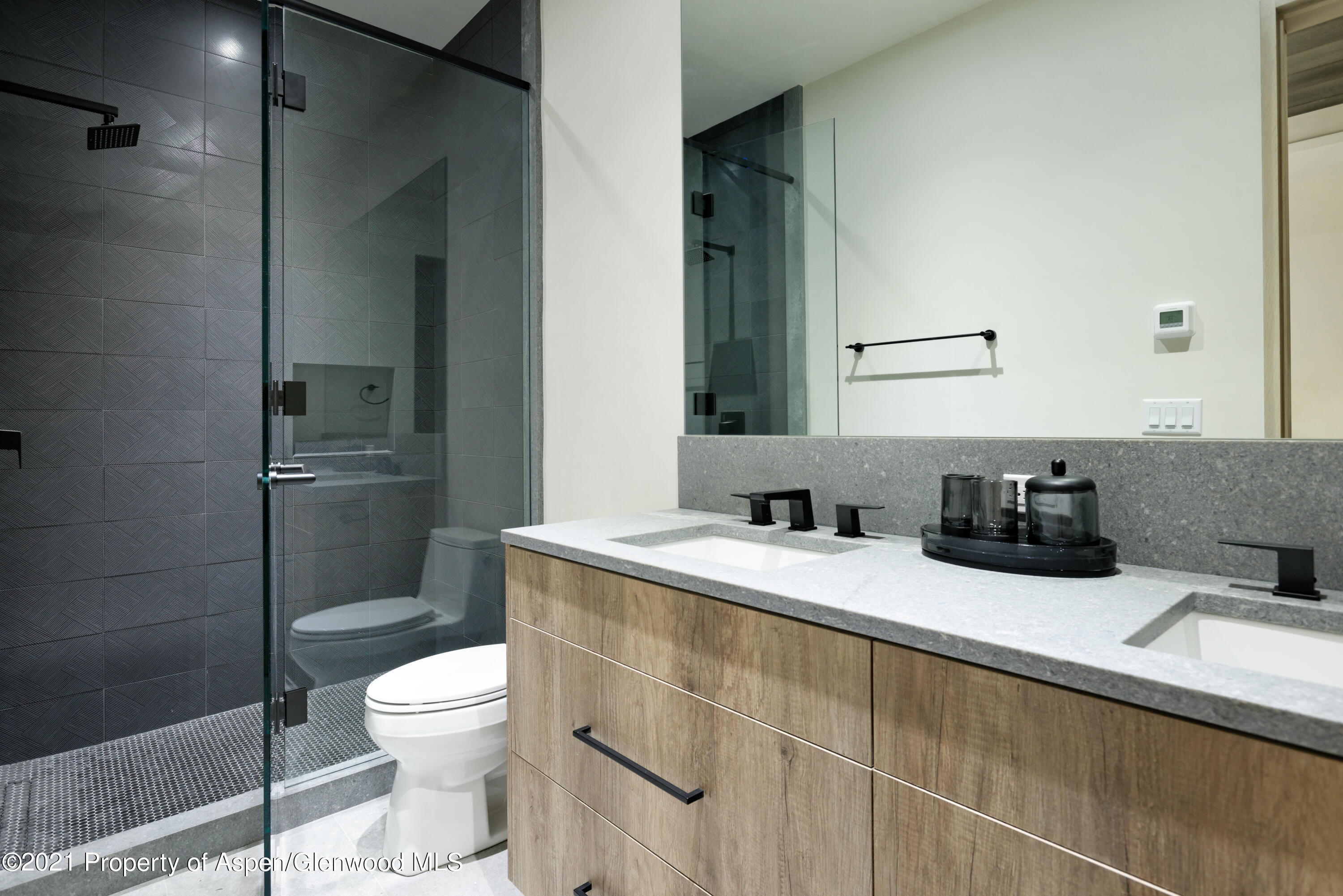 144 Bridge Lane Snowmass Village, CO 81615 - Photo 13 of 28 a bathroom with a sink toilet and shower