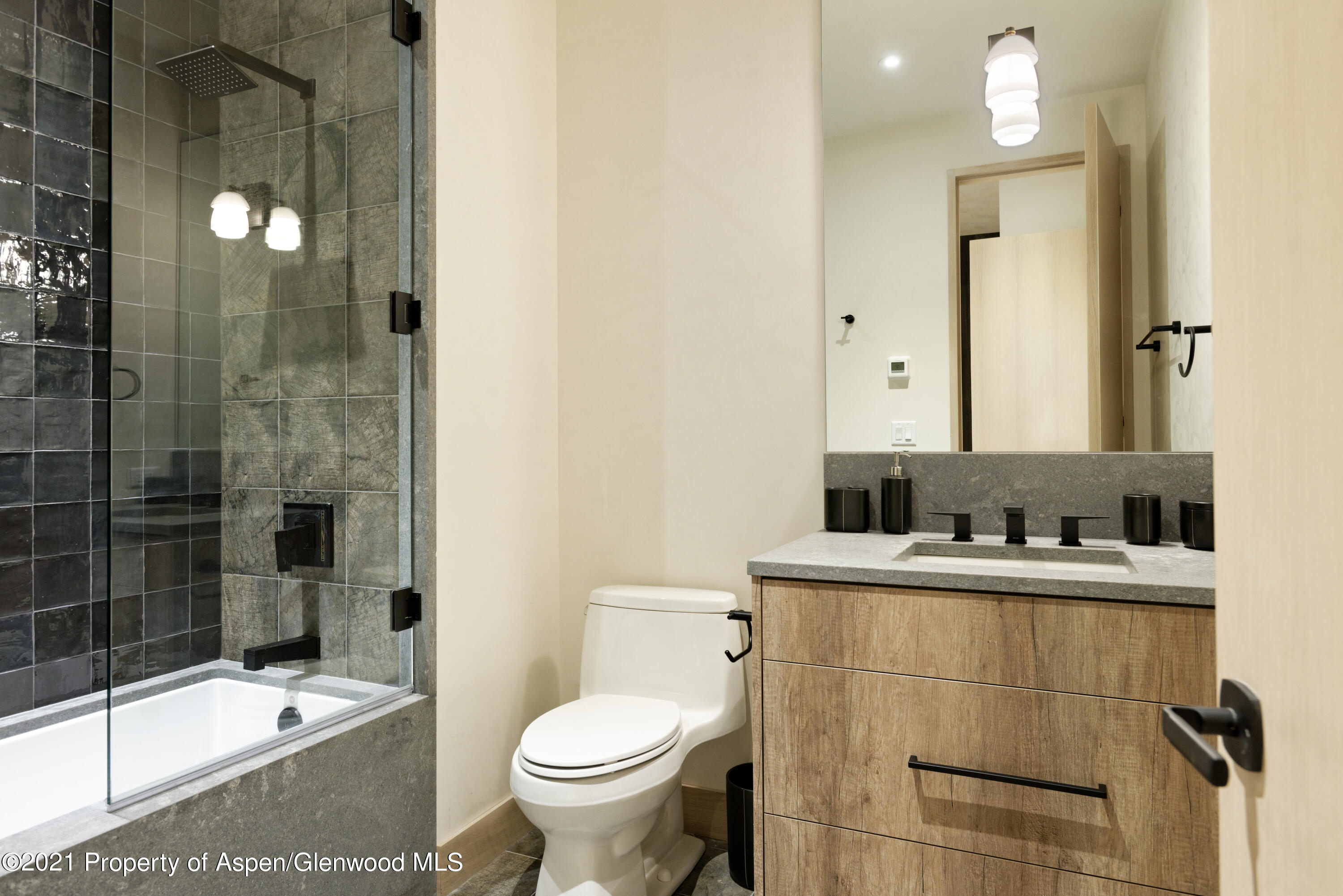 144 Bridge Lane Snowmass Village, CO 81615 - Photo 17 of 28 a bathroom with a sink a toilet and shower