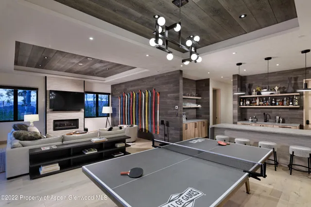 a living room filled with furniture and a flat screen tv