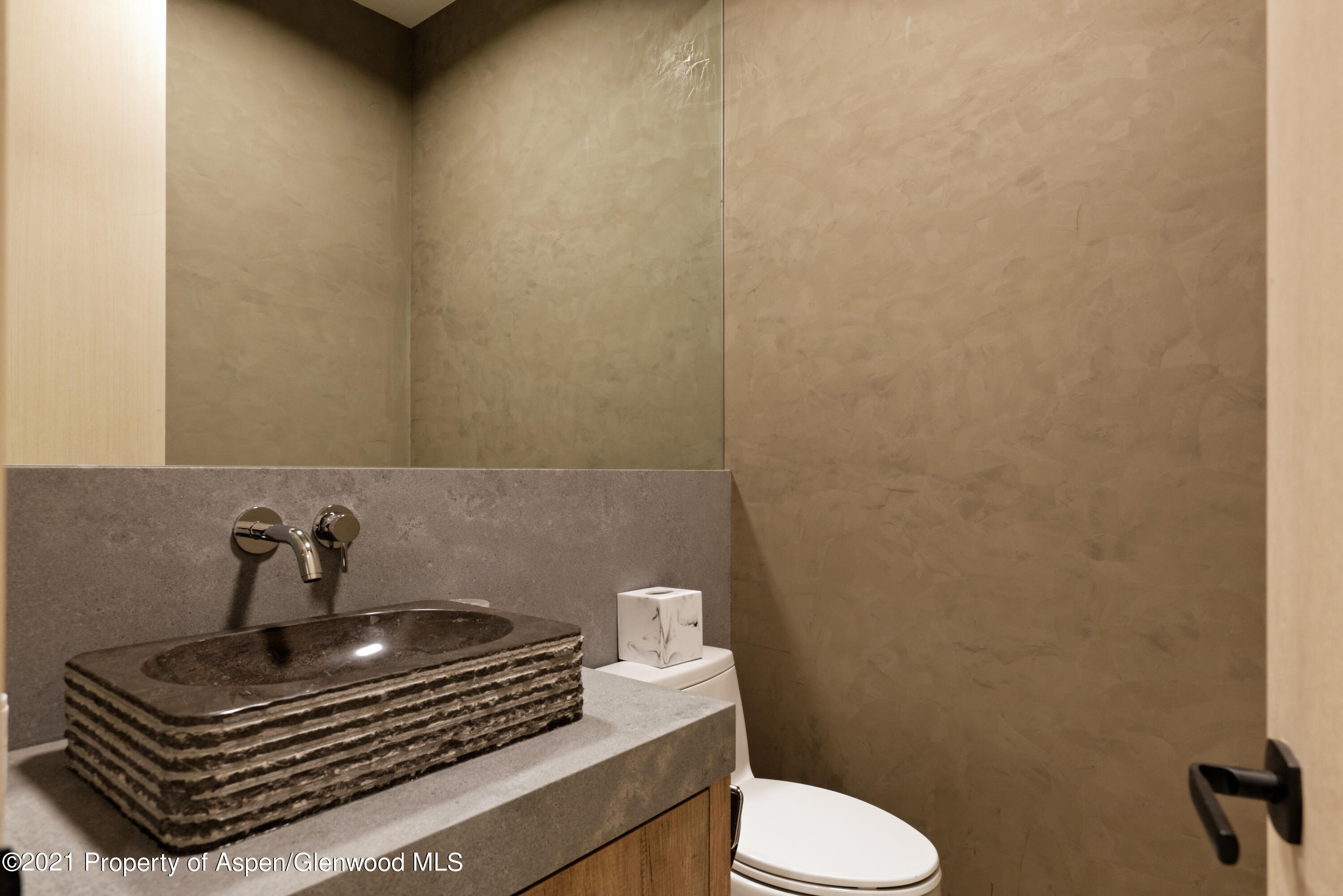 144 Bridge Lane Snowmass Village, CO 81615 - Photo 22 of 28 a bathroom with a sink toilet and a mirror
