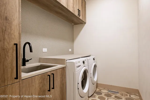 a utility room with dryer and washer