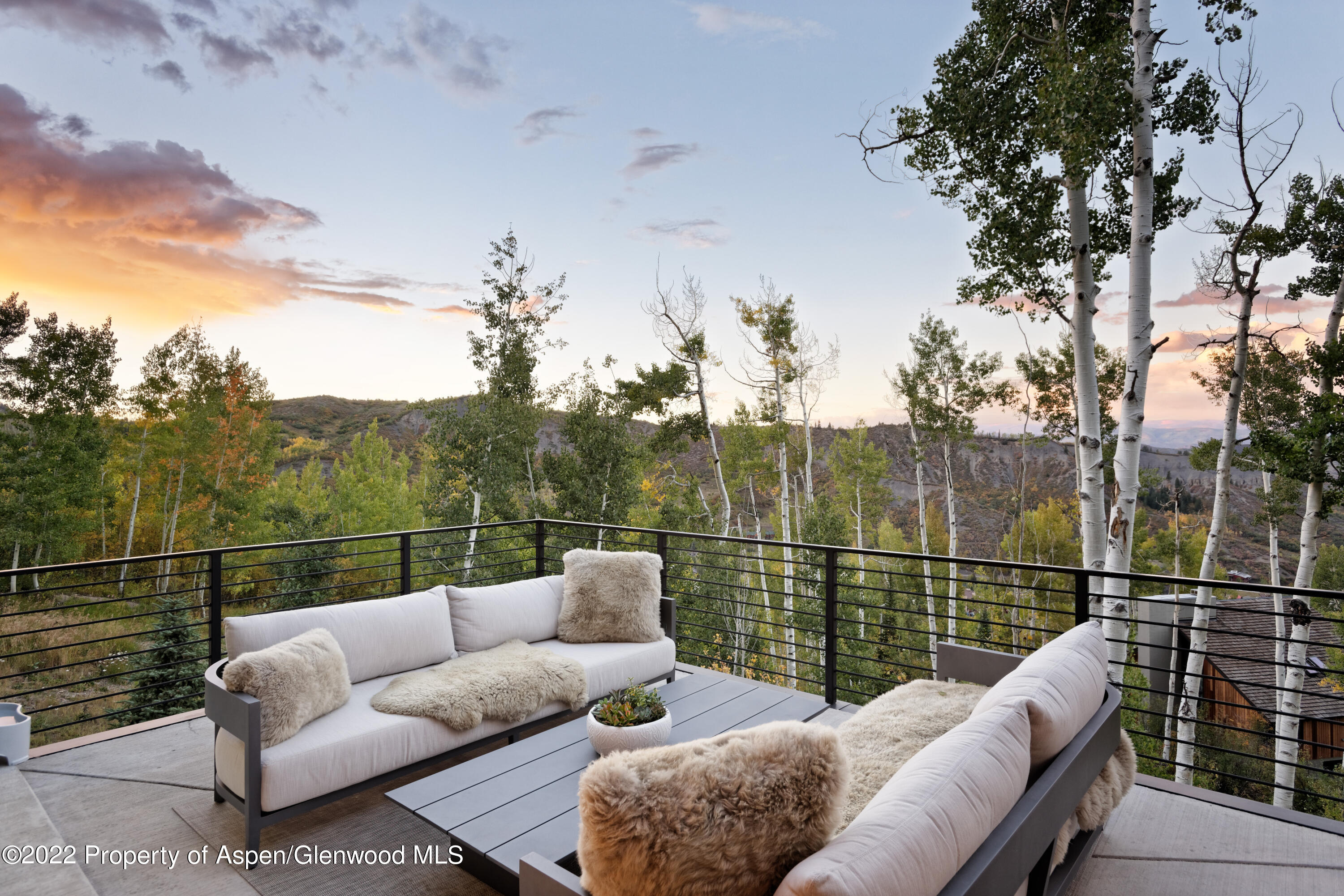144 Bridge Lane Snowmass Village, CO 81615 - Photo 26 of 28 a view of a roof deck with couches and sky view