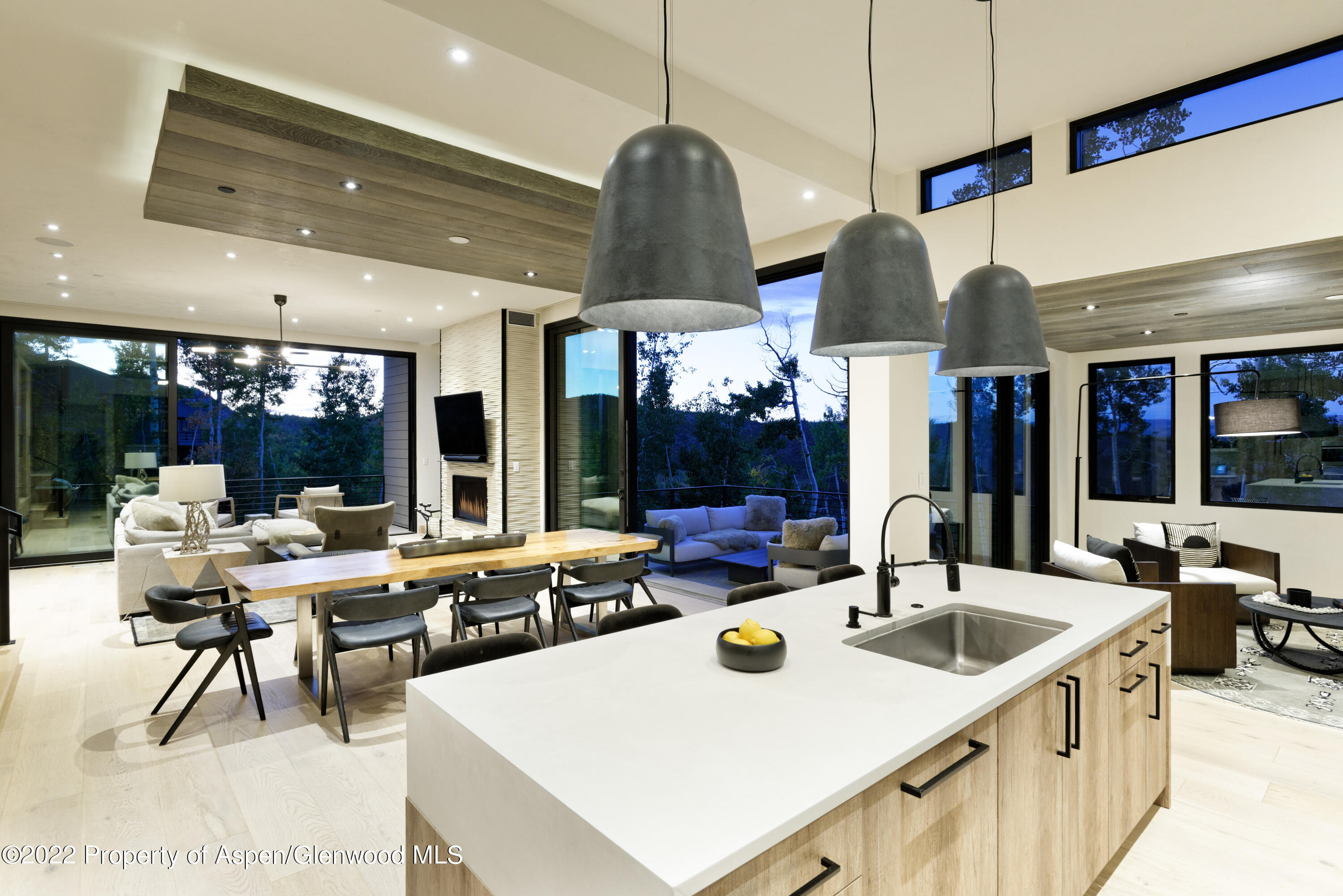 144 Bridge Lane Snowmass Village, CO 81615 - Photo 3 of 28 a kitchen with a table chairs and a view of living room