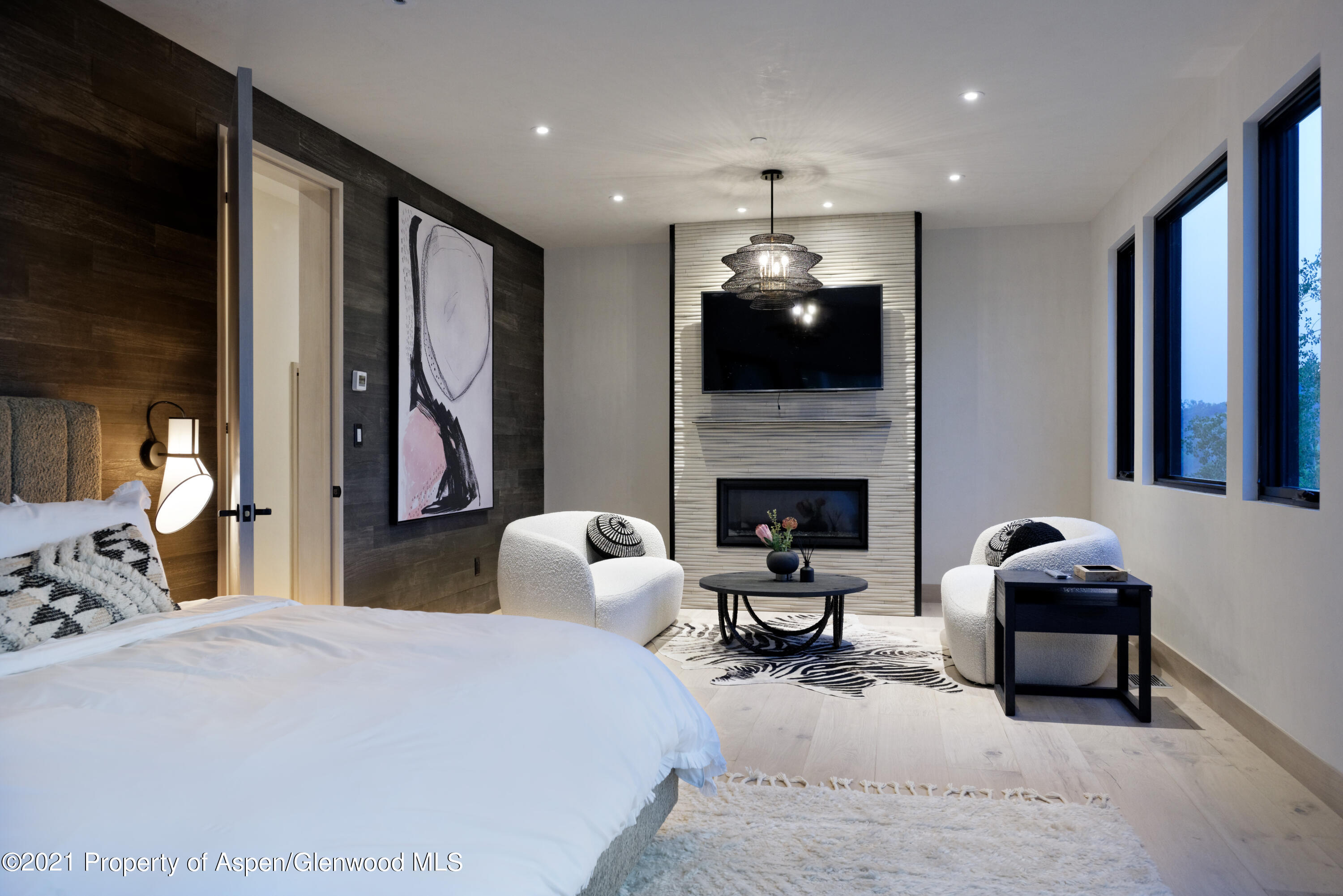 144 Bridge Lane Snowmass Village, CO 81615 - Photo 6 of 28 a bedroom with furniture and a fireplace