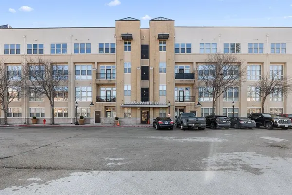a view of a cars parked in front of a building