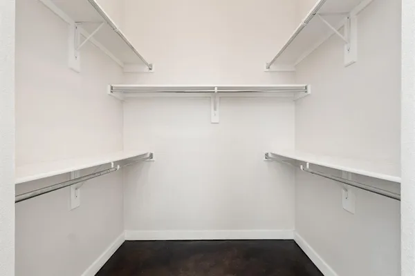 a view of an empty walk in closet