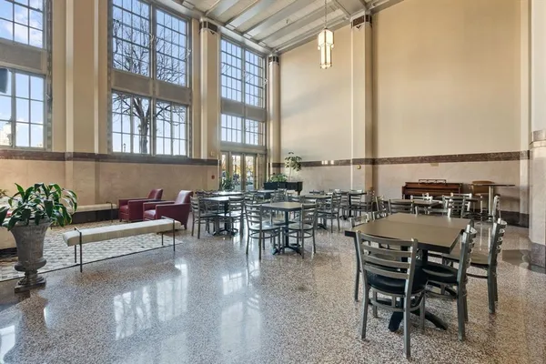 a view of a dining room with furniture window and outside view