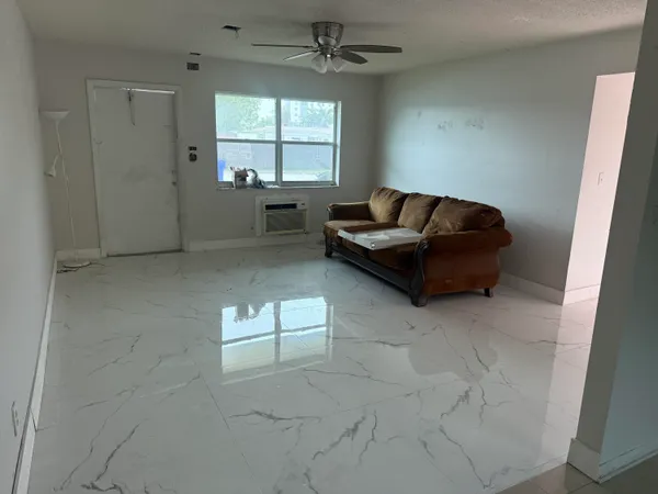a living room with furniture and window