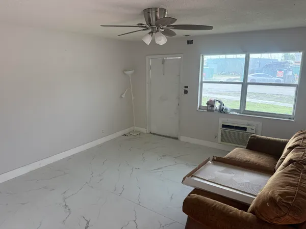 a living room with furniture and a window