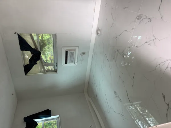 a bathroom with a bathtub and shower