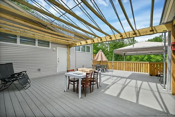 a view of a livingroom with furniture and staircase