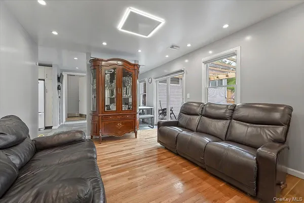 a spacious bedroom with a bed and a dresser