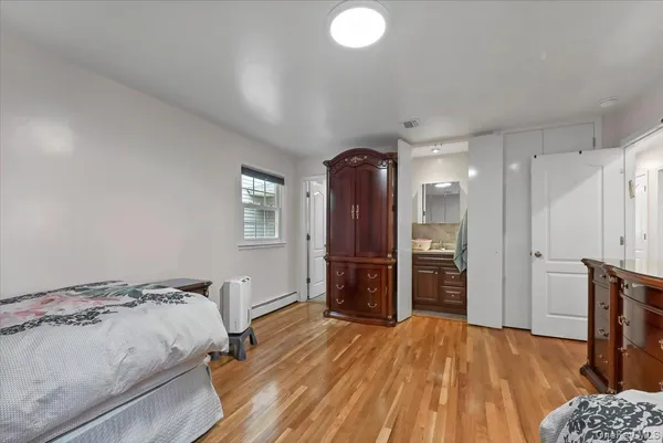 a view of a hallway with seating area and a couch