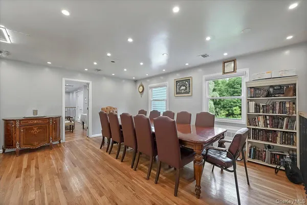 a spacious bedroom with a bed and a view of bathroom
