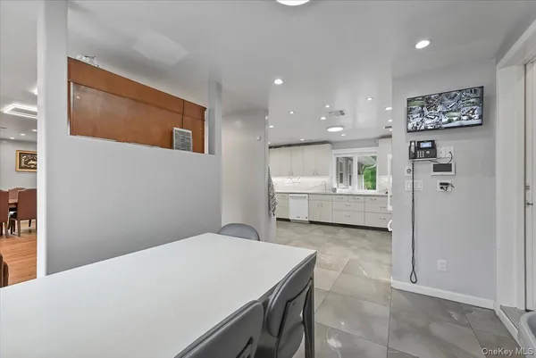 a utility room with sink dryer and washer