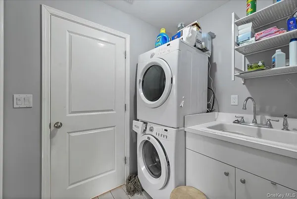 a living room with furniture and a mirror