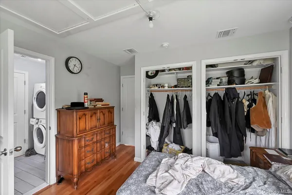 a bedroom with furniture and a window