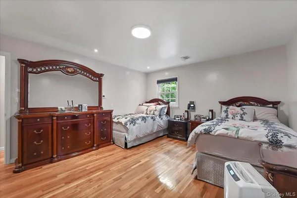 a bedroom with a bed and a table