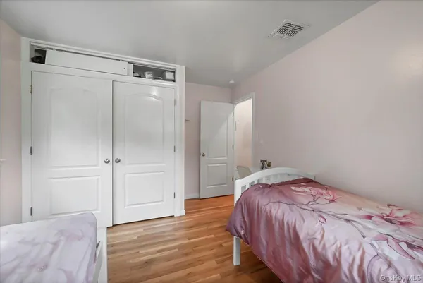 a living room with furniture and a book shelf