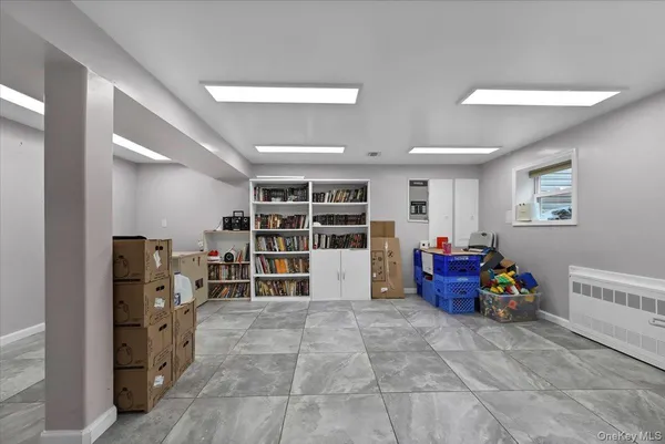 a white bath tub sitting next to a white toilet and sink