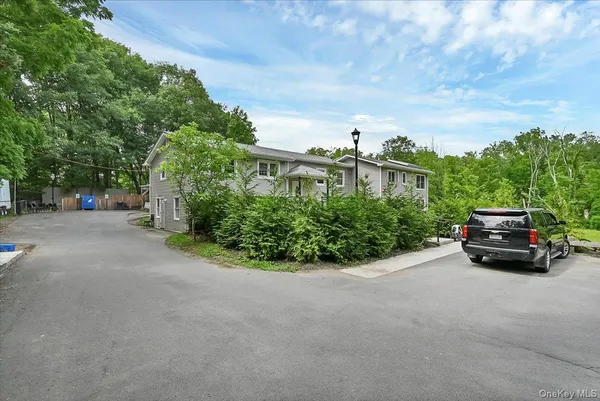 a view of a car in front of a house