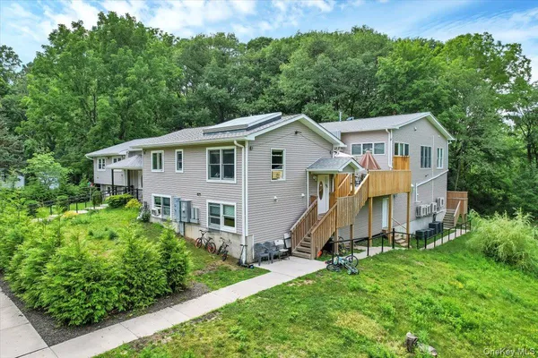 a view of a white house with large windows
