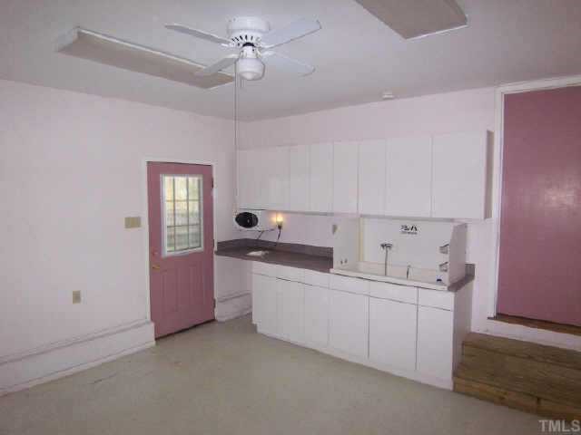 5909 Lake Elton Road Durham, NC 27713 - Photo 8 of 9 Hobby room was used for business. Could have many uses including rec room, exercise room, workshop, storage, etc. Heated with wall unit and cooled with window A/C. Cabinets, counters, and work sink already installed. Access to covered patio in back