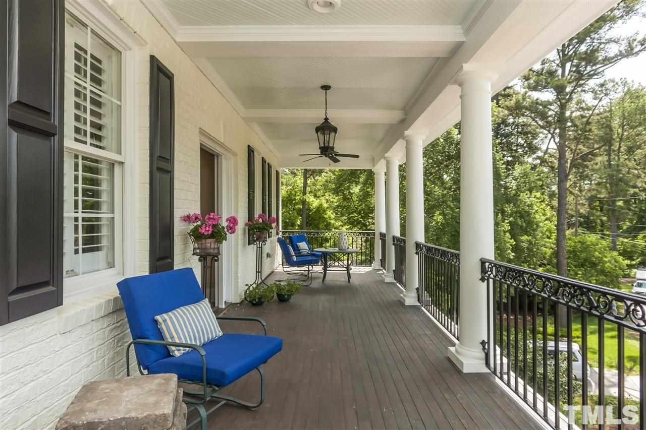 2933 Claremont Road Raleigh, NC 27608 - Photo 14 of 25 a view of a porch with furniture and a yard