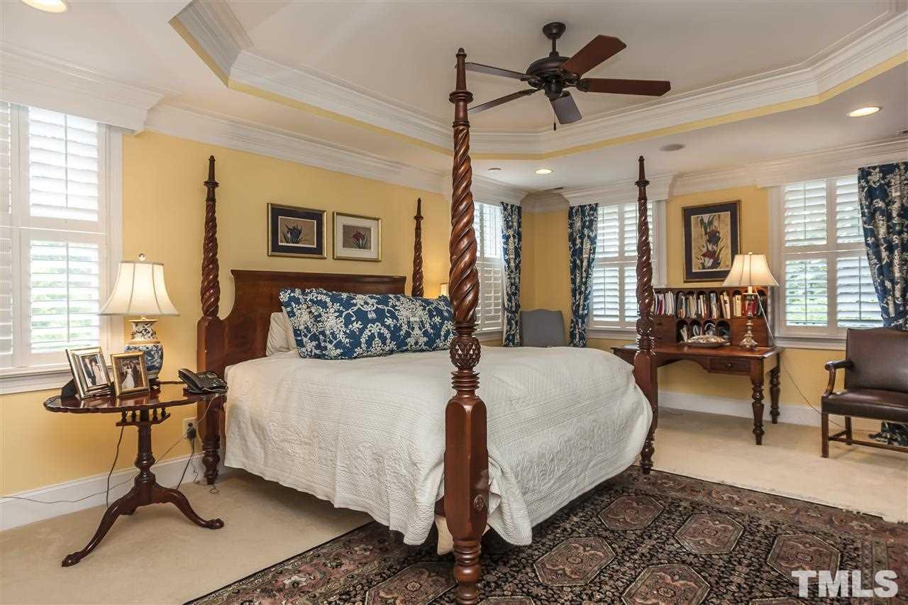 2933 Claremont Road Raleigh, NC 27608 - Photo 15 of 25 a bedroom with a bed couch and window
