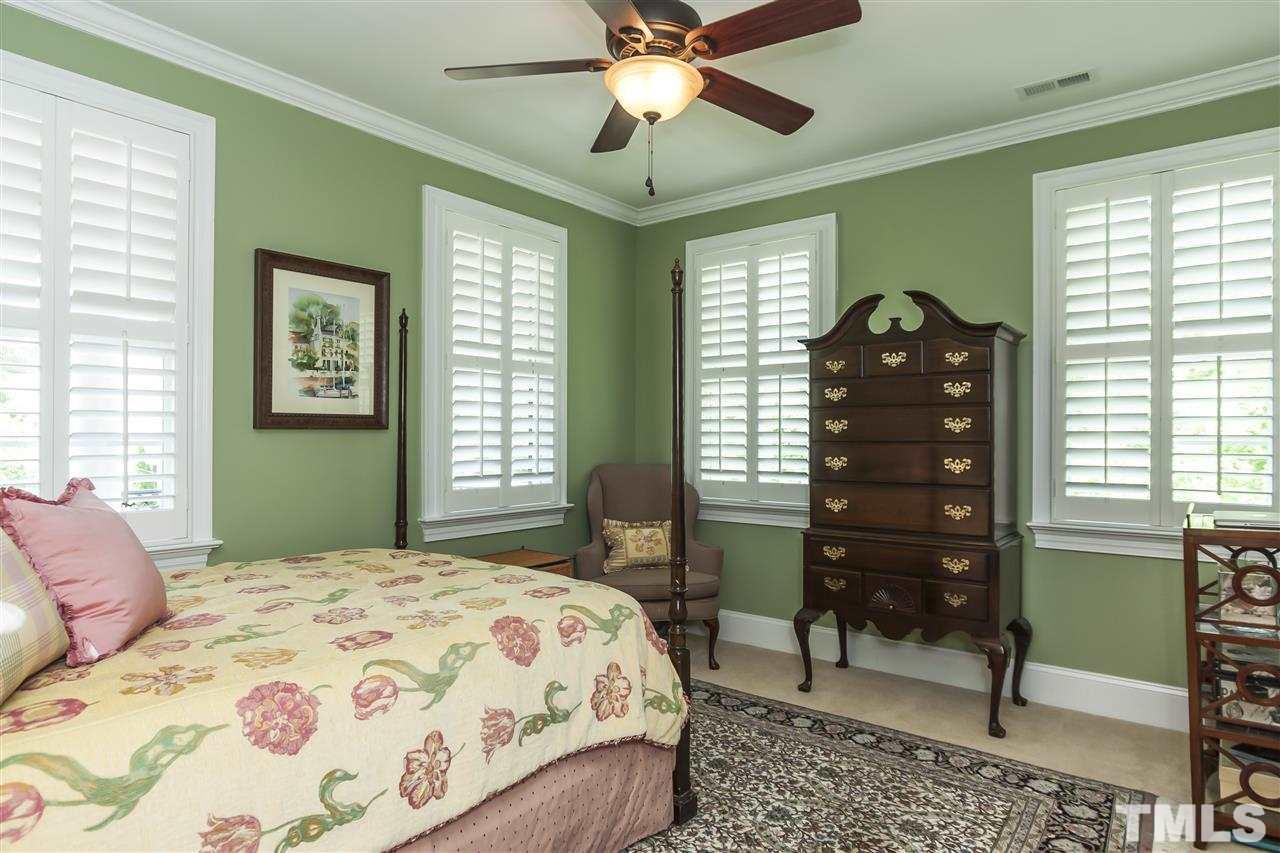 2933 Claremont Road Raleigh, NC 27608 - Photo 18 of 25 a bedroom with a bed dresser and a window