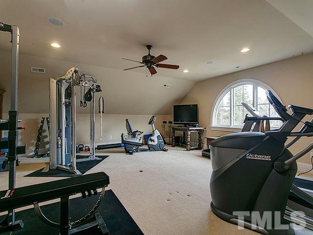 2933 Claremont Road Raleigh, NC 27608 - Photo 20 of 25 a view of a livingroom with furniture and a flat screen tv