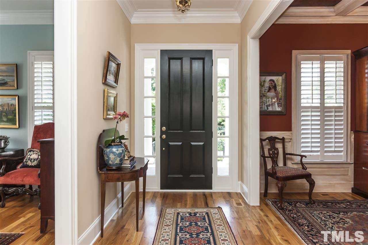2933 Claremont Road Raleigh, NC 27608 - Photo 3 of 25 a view of a entryway door of the house and living room