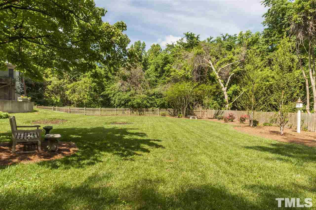 2933 Claremont Road Raleigh, NC 27608 - Photo 24 of 25 a view of a yard with a tree