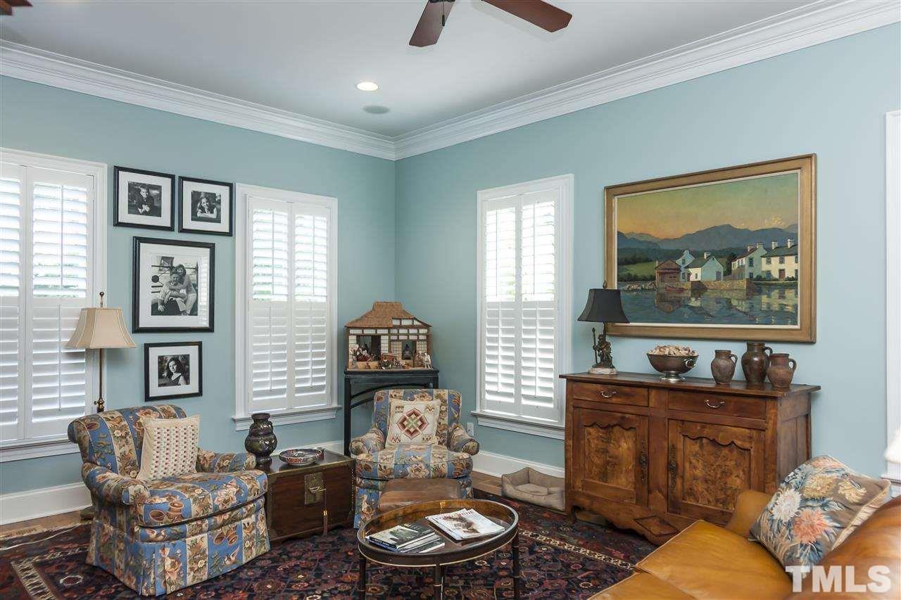 2933 Claremont Road Raleigh, NC 27608 - Photo 7 of 25 a living room with furniture and a window