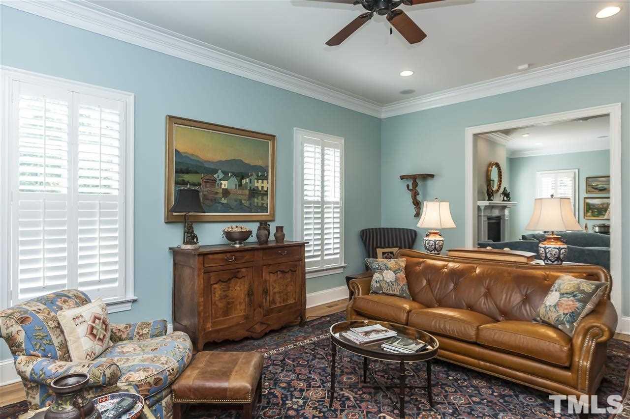 2933 Claremont Road Raleigh, NC 27608 - Photo 8 of 25 a living room with furniture and a window