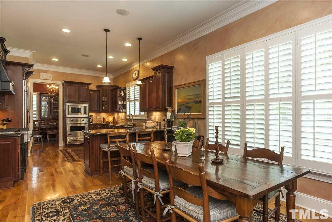 2933 Claremont Road Raleigh, NC 27608 - Photo 10 of 25 a view of a dining room with furniture