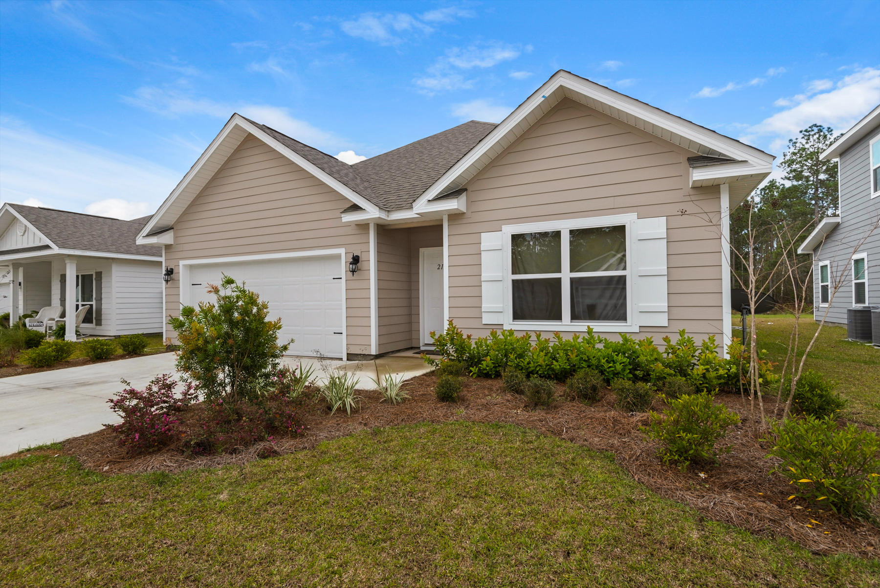 214 Southern Pines Road Santa Rosa Beach, FL 32459 - Photo 1 of 27 a view of house with a yard and potted plants