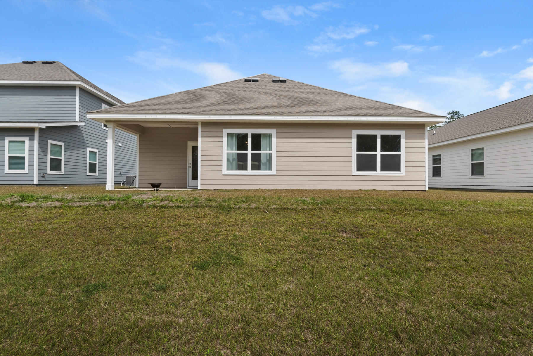 214 Southern Pines Road Santa Rosa Beach, FL 32459 - Photo 12 of 27 a front view of house with yard and trees around