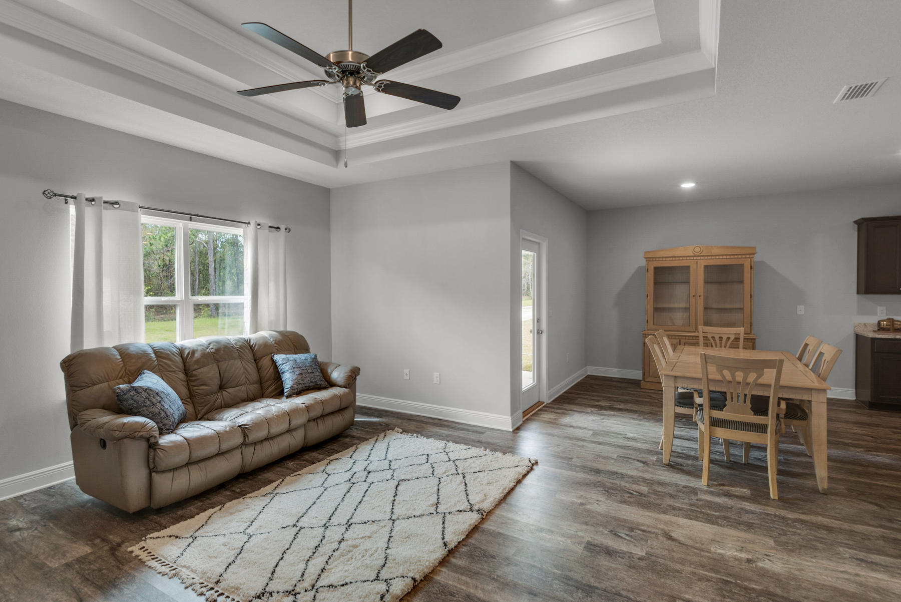 214 Southern Pines Road Santa Rosa Beach, FL 32459 - Photo 15 of 27 a living room with furniture a ceiling fan and a window