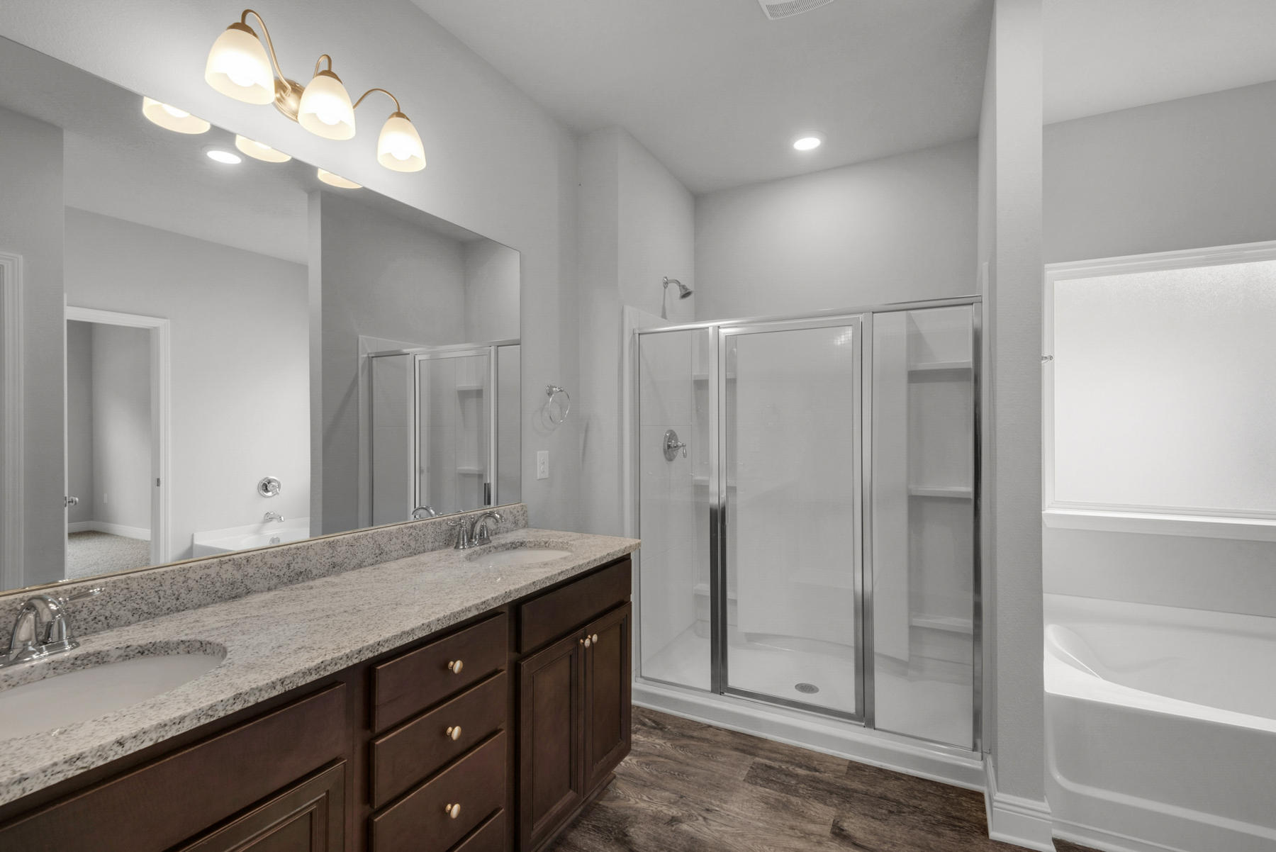 214 Southern Pines Road Santa Rosa Beach, FL 32459 - Photo 19 of 27 a bathroom with a granite countertop sink a large mirror and a shower