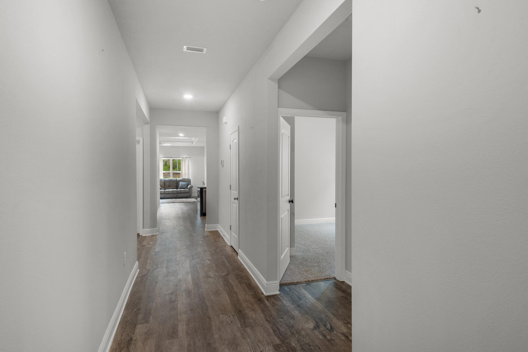 214 Southern Pines Road Santa Rosa Beach, FL 32459 - Photo 5 of 27 a view of a hallway with wooden floor