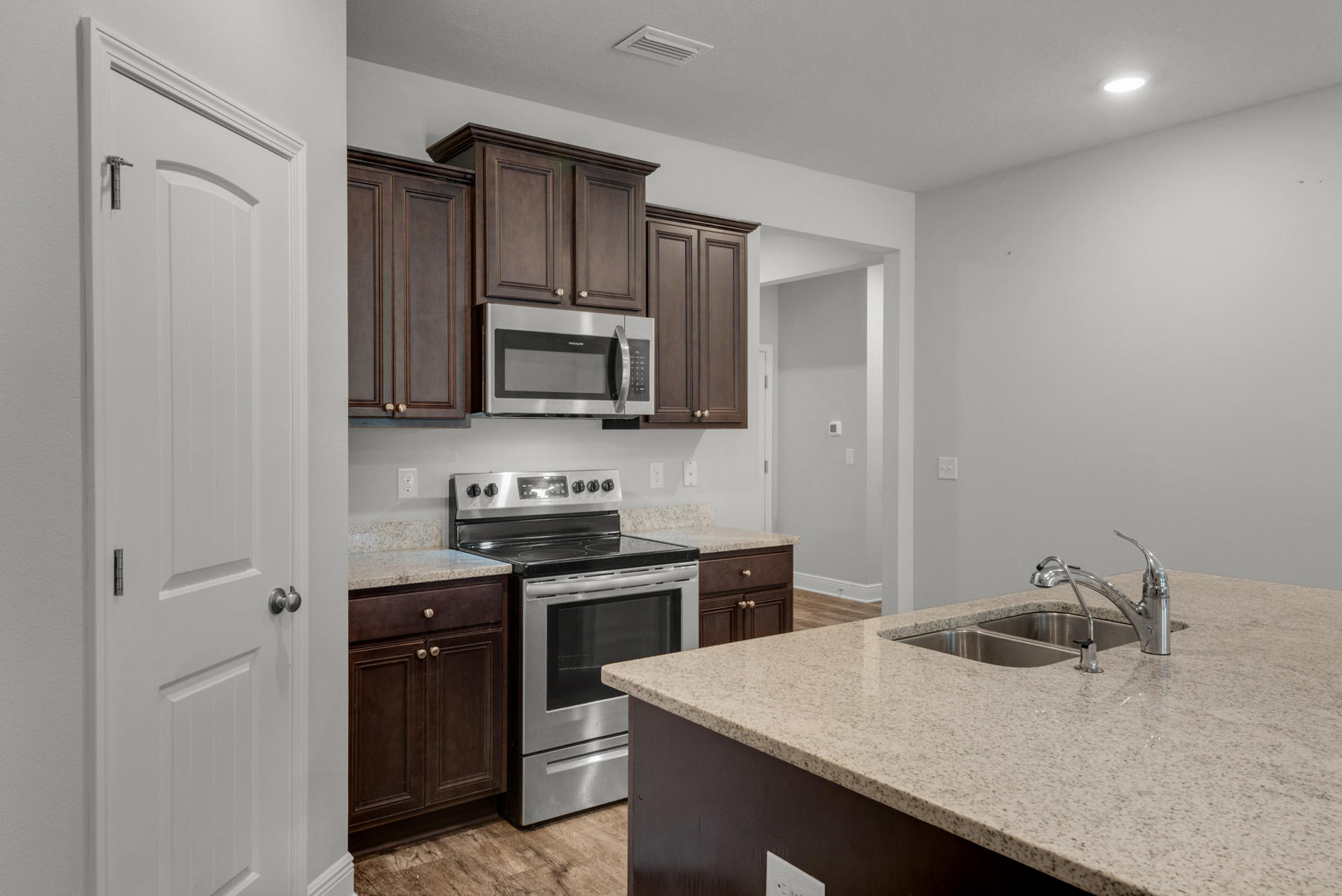 214 Southern Pines Road Santa Rosa Beach, FL 32459 - Photo 8 of 27 a kitchen with a sink and cabinets
